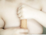 Huge natural asian girl tit fucks a dildo