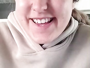 girl stripping in front of the camera