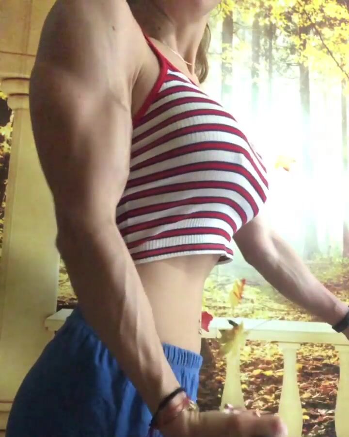 Cute girl pumping biceps