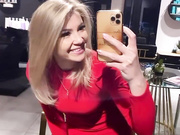 Sexy blonde in red dress and shiny nude pantyhose