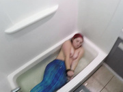 Mermaid blowjob in bathtub