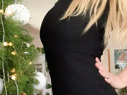 KiwiGirlGigi in a Black Dress by the Christmas Tree