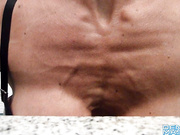 Muscle Girl push ups in bathroom with massive tits