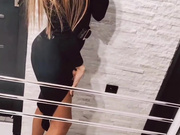 Sexy Polish blonde in dress and shiny nude pantyhose