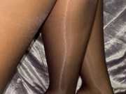 Jasmine shows her legs and feet in shiny black nylons