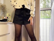 Sexy Polish blonde shows her legs in shiny black nylons