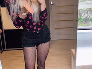 Sexy Polish blonde in shorts and fishnet pantyhose