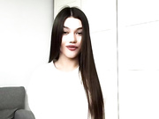 Sexy clothed brunette shows her legs in shiny pantyhose