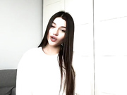 Sexy clothed brunette shows her legs in shiny pantyhose