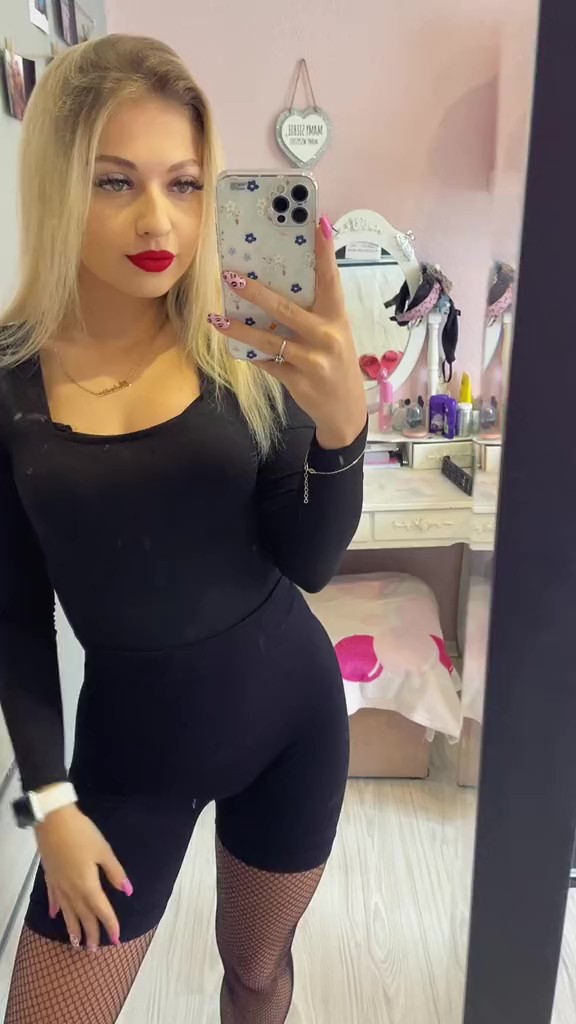 Sexy Polish blonde in shorts & black fishnet pantyhose