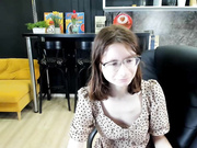 Cute nerdy girl gets undressed and masturbates