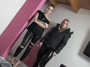 Two girls in leather leggings