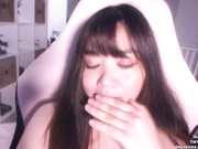 Fat asian girl ClaraChan tries to be sexy.