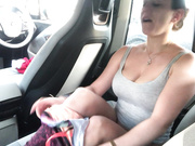 Suzie212 fucks herself in the back of her car